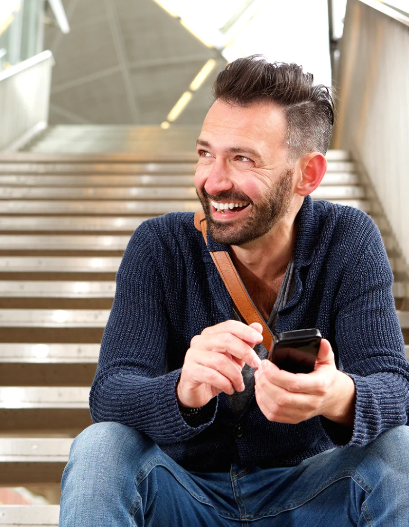 Man Looking At Hair In Mirror
